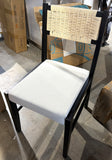 Black wood dining chair with woven rope back and white boucle seat