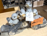 Alpine QWR1436 ducklings on a tree log garden statue
