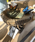 Tree stump birdbath with monarch and blue butterflies