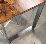 Silver/gray metal U-shaped (sled) table frame detail