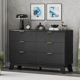 47" fluted 6-drawer dresser in black with gold handles – front view styled with wall art