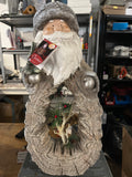 21-inch Santa Statue with a Carved Wood Look and LED lights.