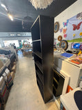 Tall and narrow black bookshelf