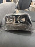1999–2004 Jeep Grand Cherokee Black Housing Headlight Assembly Set – Left & Right