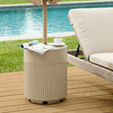 Beige patio umbrella base used as an outdoor side table on a deck