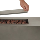 Real Flame Aegean 70 inch rectangle propane fire pit table in Mist Gray – placing the burner lid (stock photo)