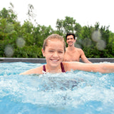 Bestway Platinum Series Power Steel 20 x 12 ft x 48 in oval above ground pool set – family swimming in the pool (stock photo)