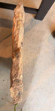 Side view of the solid natural sandstone slab showing its thickness and rough natural edge
