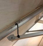 10' x 13' rectangular aluminum cantilever offset patio umbrella, light gray canopy – real close-up of the damaged rib/arm bracket (sold as is)