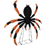 Black and orange fabric spider decoration with bendable wire legs and purple LED lights – angled view