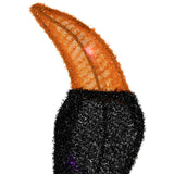 Close detail of lighted spider Halloween décor with purple LED lights on black fabric body