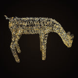 Alpine DXP114 gold grazing reindeer doe glowing with warm white LED fairy lights – on a dark background