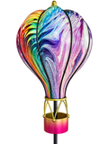 Close-up of the rainbow swirl glass balloon, black frame and gold and pink basket