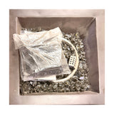 Alpine stone look column fire pit – top view of the square burner basin filled with tempered fire glass, real photo