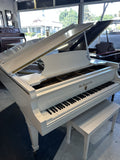 Wm. Knabe & Co. white grand piano with lid raised – side view of the curved case