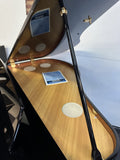 Kohler digital grand piano with lid raised showing the speaker panel inside