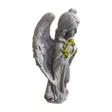 Alpine solar LED angel statue holding a yellow rose wreath – real photo, side