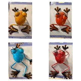 Alpine metal garden frog décor, all four colors – Yellow/Gold, Orange, Blue, and Red Speckled, on their cards