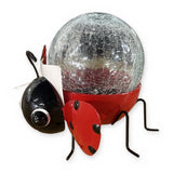 Solar ladybug garden statue with crackle glass globe – side view on white