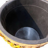 Woven watering can planter – inside view of the removable black plastic liner